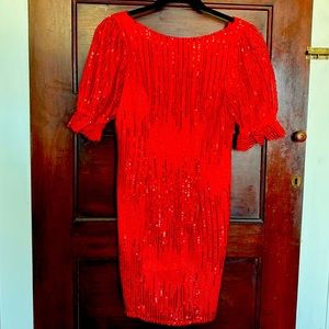 Red embellished, beaded, backless, cocktail dress.